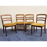 SET OF FOUR G PLAN TEAK DINING CHAIRS with ladder backs above pale yellow velvet padded seats,