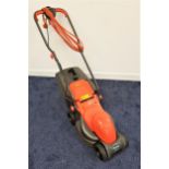 FLYMO EASIMO ELECTRIC LAWNMOWER with a grass collection rear basket and a 32cm cut