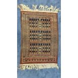 AFGHAN KUNDUZ RUG with a blue ground and coral embellishments, fringed, 138cm x 97cm