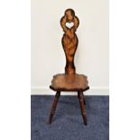 SCOTTISH MAHOGANY SPINNING CHAIR with a shaped back with a carved heart handle and poker work