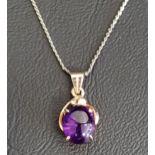 AMETHYST SINGLE STONE PENDANT the oval cabochon amethyst in fourteen carat gold, on eighteen carat