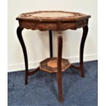 EDWARDIAN OAK WINDOW TABLE with a carved octagonal top decorated with fruiting vines, standing on
