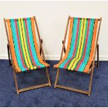 TWO FOLDING DECKCHAIRS with traditional stripped material (2)