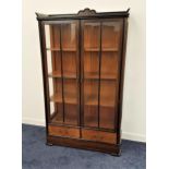 1930s COROMANDEL DISPLAY CABINET with a three quarter gallery top with a carved fan detail above two