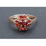 GARNET CLUSTER RING on nine carat gold shank, ring size L and approximately 1.9 grams