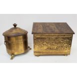 BRASS EMBOSSED COAL BIN with a sloping lid and lift out liner, decorated with Cromwellian scenes,