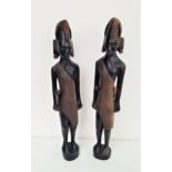 TWO AFRICAN CARVED MAASAI TRIBESMEN in ebony and carrying weapons, 60cm high (2)