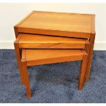 TEAK NEST OF TABLES with rectangular tops on plain supports, 44.5cm high
