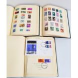 THREE STAMP ALBUMS with a selection of world stamps from Aden, Argentina, British Guiana, Canada,