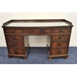 THOMAS H. KERR MAHOGANY KNEEHOLE DESK with a bow front and a three quarter gallery back above an