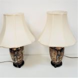 PAIR OF CHINESE TABLE LAMPS with a green ground decorated with panels of birds and flowers, together