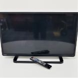 TOSHIBA COLOUR TELEVISION with a 32" screen, scart and HDMI port, model 32W2433D