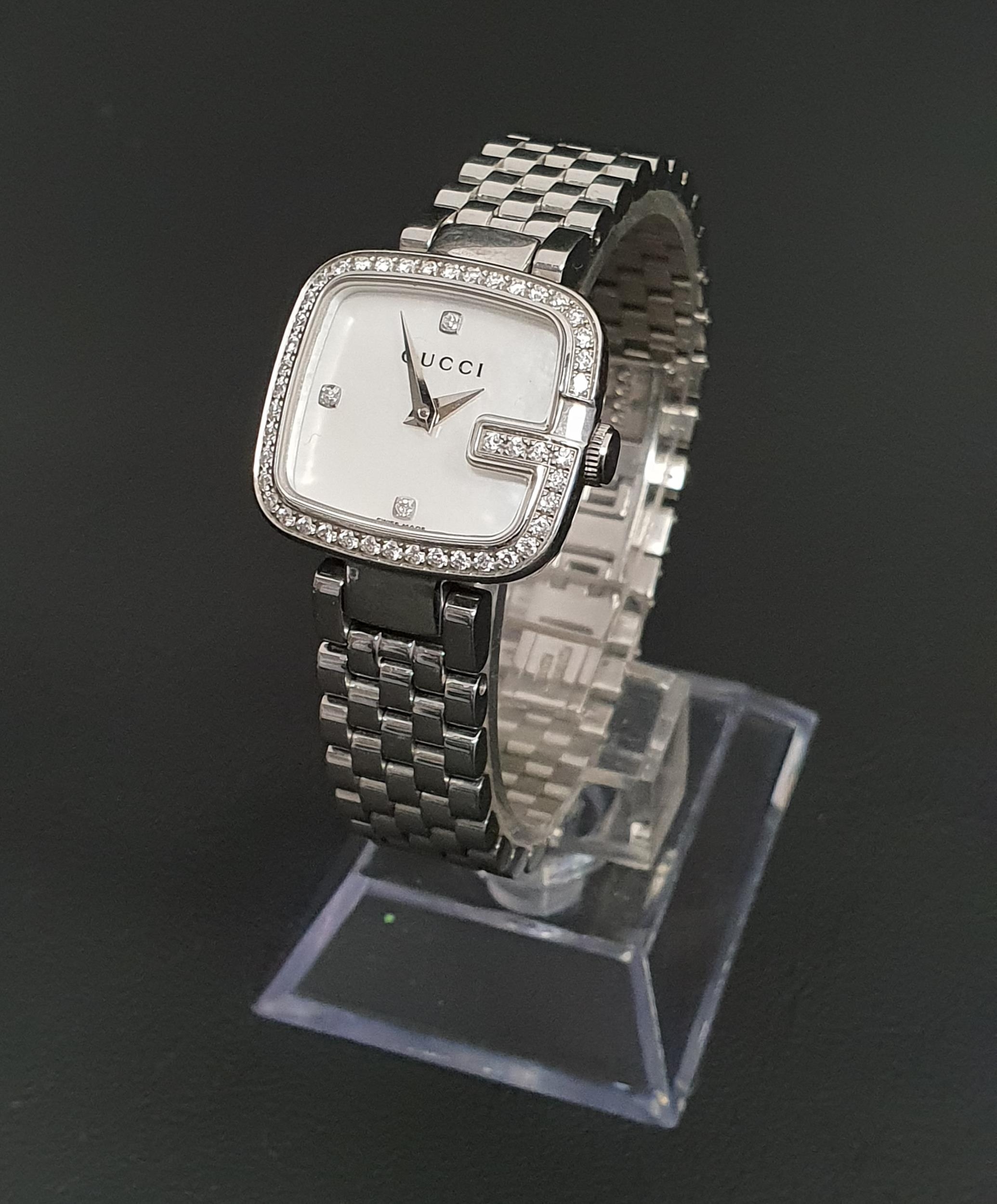 LADIES GUCCI G WRISTWATCH with crystal set bezel, model number 125.5, the backplate also numbered