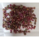 CERTIFIED LOOSE NATURAL RUBIES the rough cut rubies weighing 56.15cts, with igl&i Gemmological