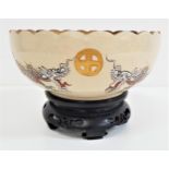 JAPANESE SATSUMA BOWL with a scalloped gilt edge rim, the bowl decorated with two dragons and many