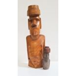 EASTER ISLAND MOAI CARVED WOOD FIGURE with carvings to both sides, 51cm high, together with a