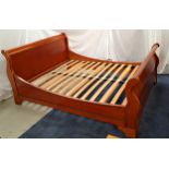 COUTURE CHERRY SLEIGH DOUBLE BED with a shaped head and foot board, and a slatted base