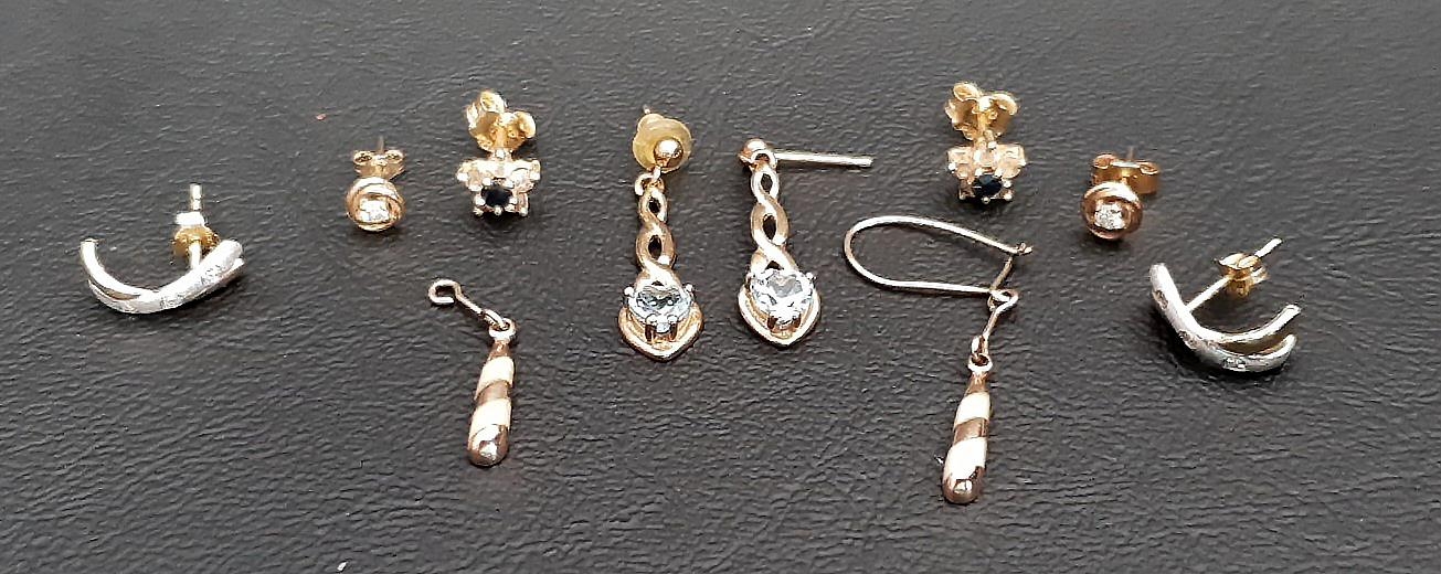 FIVE PAIRS OF GOLD EARRINGS comprising a pair of blue topaz drop earrings in nine carat gold, a pair