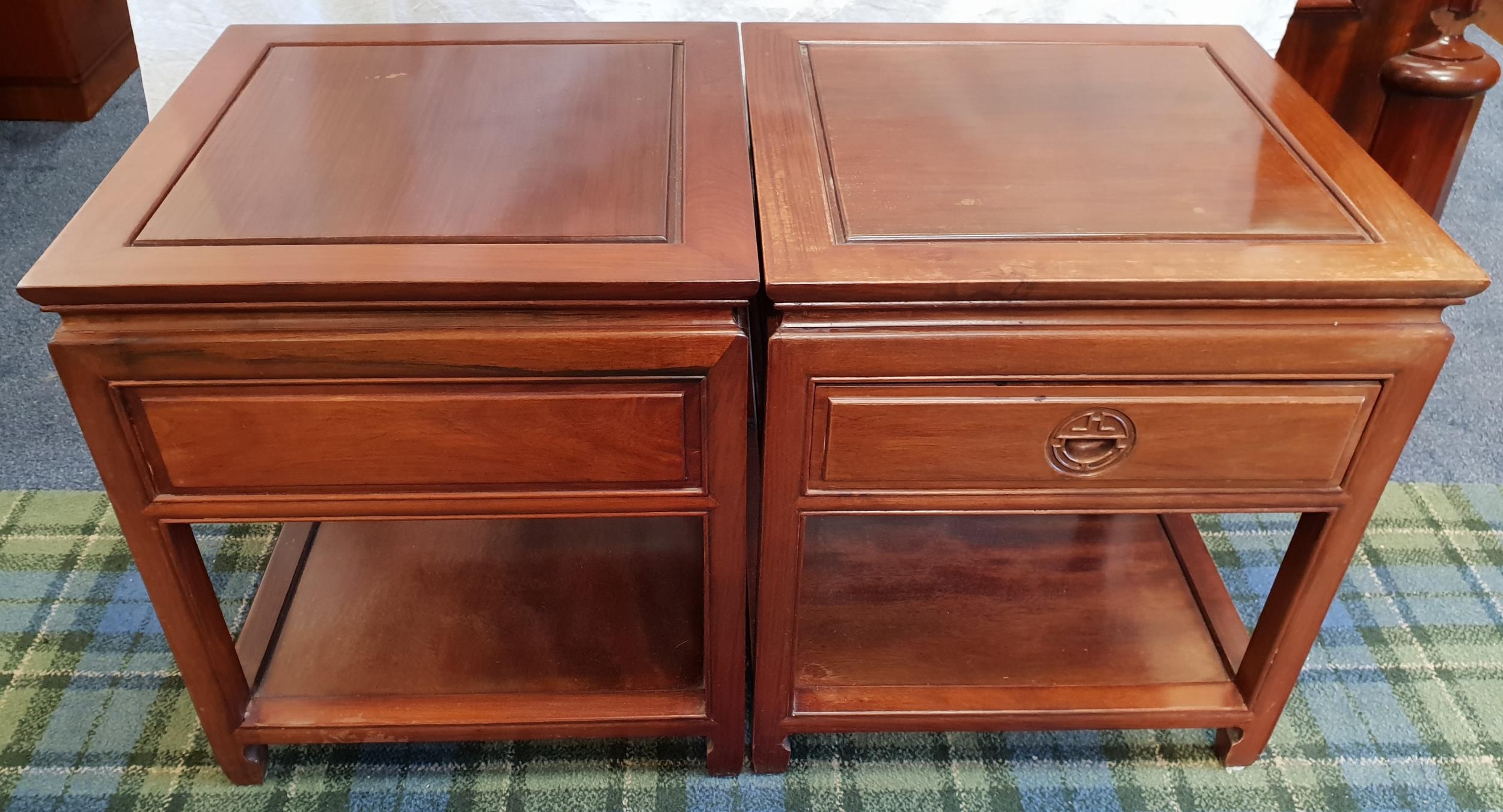 PAIR OF CHINESE TEAK SIDE TABLES each with a panelled top above a frieze panelled drawer with a