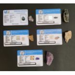 FIVE CERTIFIED LOOSE GEMSTONES comprising a rough cut natural amethyst weighing 123.9cts, a rough