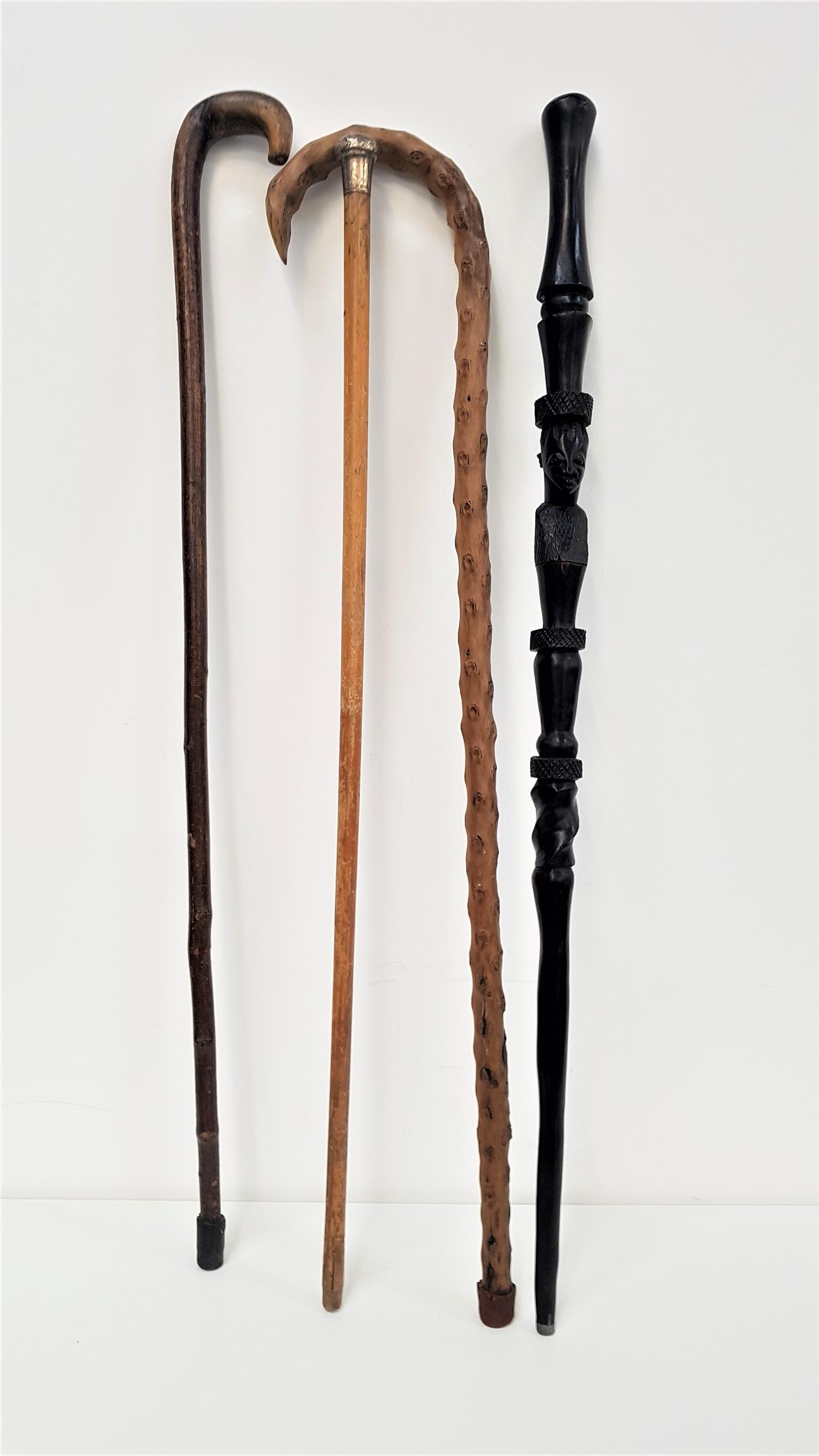 BENIN CARVED EBONY WALKING STICK with face mask detail, 92cm long; together with a silver topped