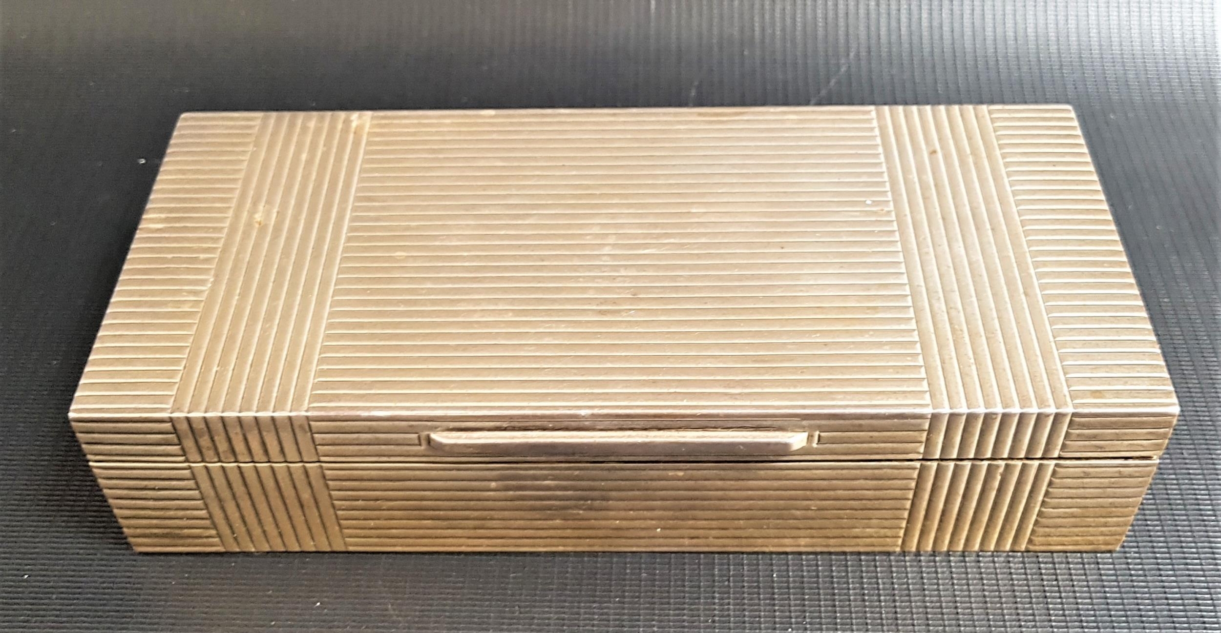 GEORGE VI SILVER CIGARETTE BOX with a ribbed body and cedar lined, the gilt lid interior