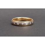 DIAMOND SET EIGHTEEN CARAT GOLD RING the seven diamonds flush set in the two tone gold band, ring