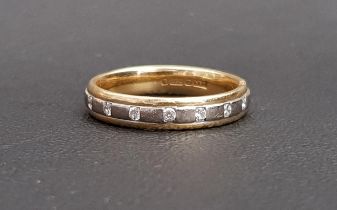 DIAMOND SET EIGHTEEN CARAT GOLD RING the seven diamonds flush set in the two tone gold band, ring