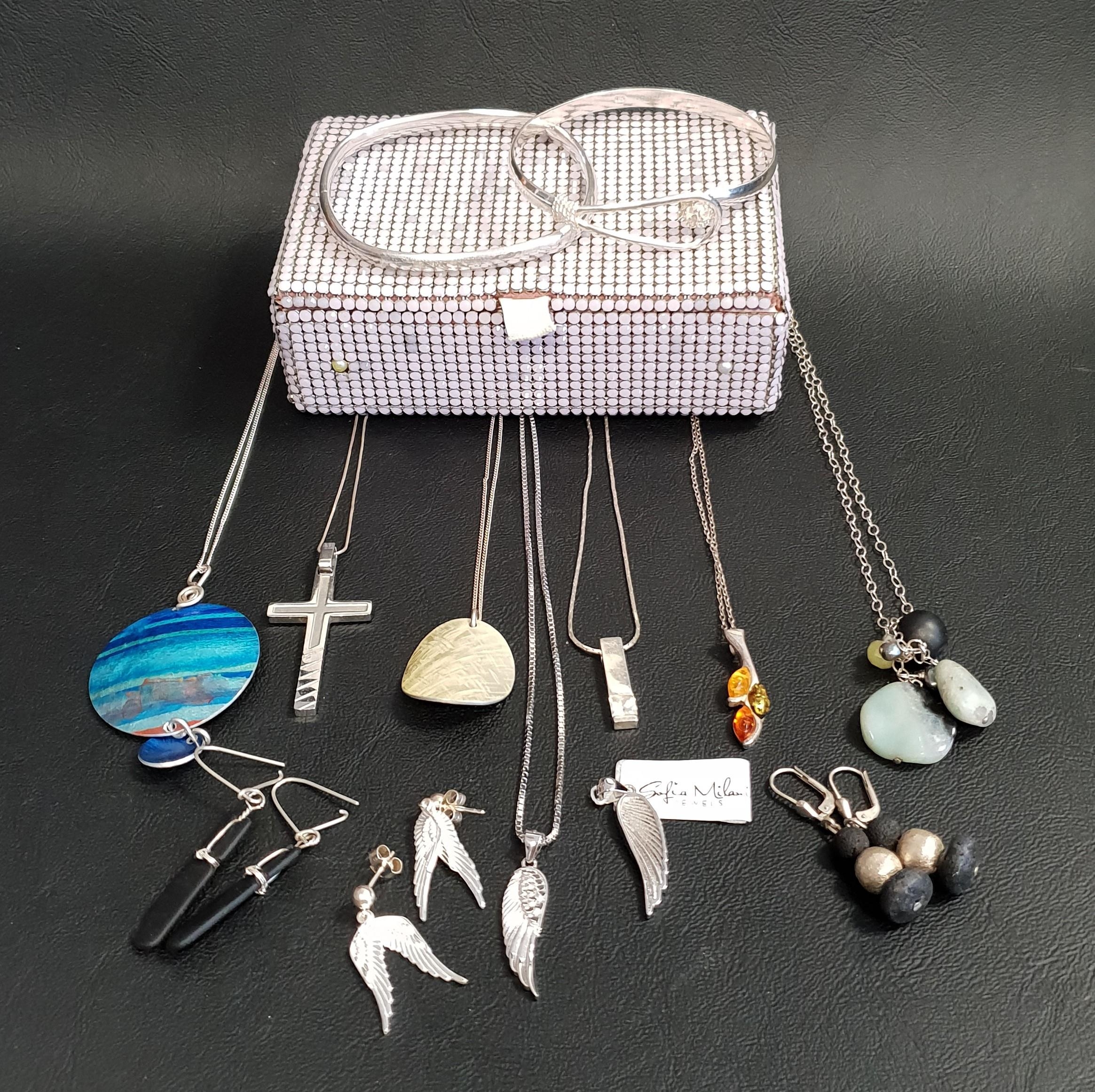 SELECTION OF MOSTLY SILVER AND SILVER MOUNTED JEWELLERY including two silver bangles, a set of angel