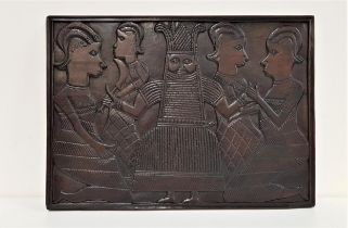 20th CENTURY CARVED BENIN PANEL depicting Oba and attendants, stained teak, 44cm x 61cm