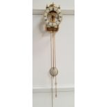 GERMAN HERMLE BRASS LANTERN STYLE CLOCK with a circular bell above a cream coloured chapter ring