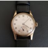 GENTLEMAN'S VINTAGE NINE CARAT GOLD CASED OMEGA WRISTWATCH dating from 1944, the dial with Arabic