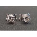 PAIR OF DIAMOND STUD EARRINGS the round brilliant cut diamond on each approximately 0.25cts (o.