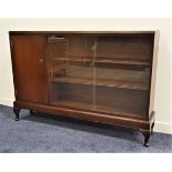 MAHOGANY SIDE CABINET the moulded top above a cupboard door and two glass sliding doors with two