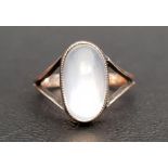 MOONSTONE SINGE STONE RING the oval cabochon moonstone on nine carat gold shank with decorative