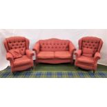THREE PIECE SUITE comprising a shaped button back sofa with slanting scroll arms and two loose