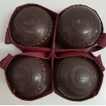 SET OF FOUR LAWN BOWLS by Henselite, size 4 and monogrammed RGD, with a carry bag