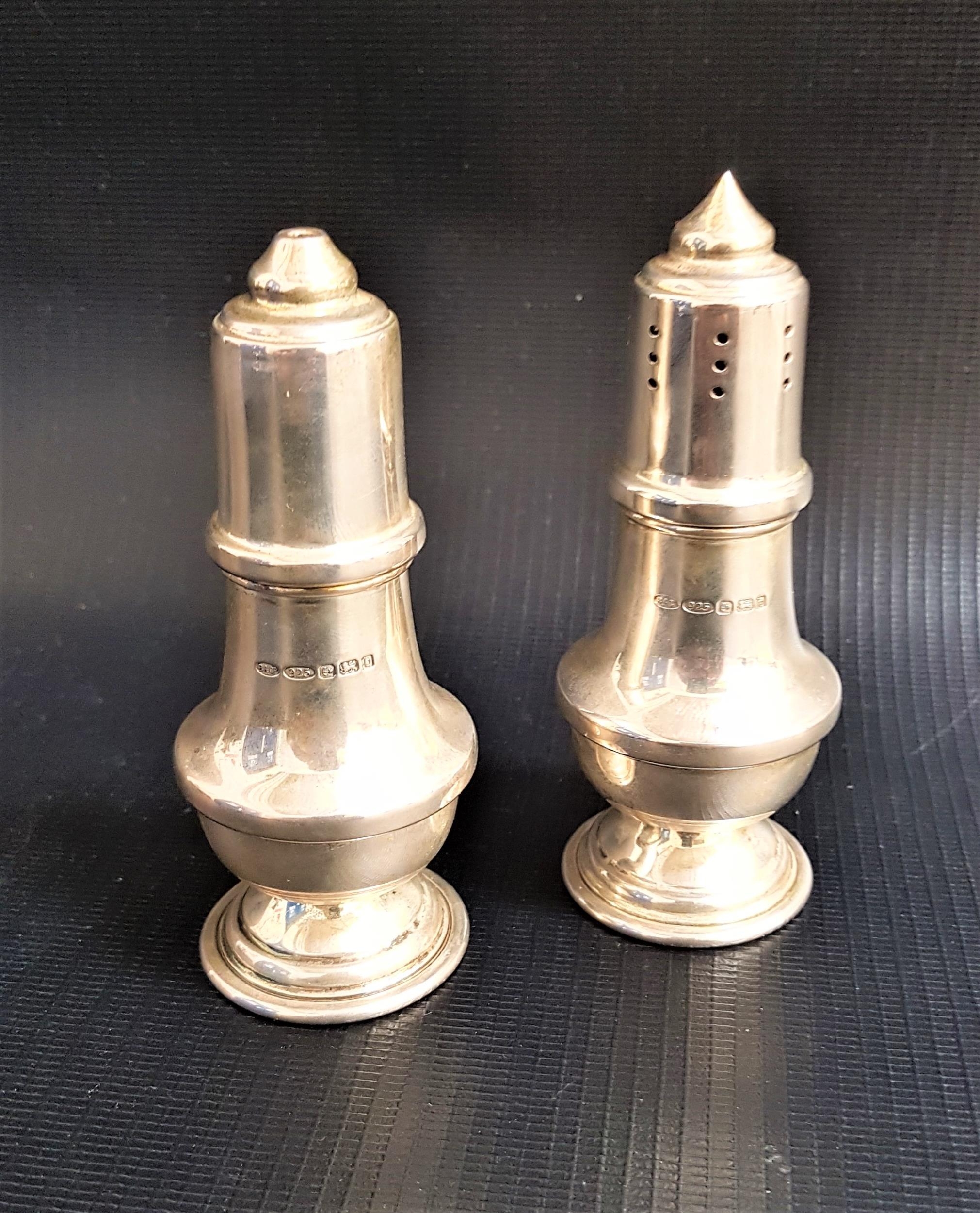 CASED PAIR OF SILVER SALT AND PEPPER CONDIMENTS Birmingham 2001, maker B&Co., approximately 110g/3.