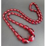 GRADUATED AMBER COLOURED BAKELITE BEAD NECKLACE 78.5cm long and approximately 53 grams