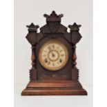 AMERICAN ANSONIA MANTLE CLOCK in a shaped mahogany case, the circular dial with a brass outer ring