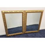 PAIR OF RECTANGULAR WALL MIRRORS with bevelled plates in giltwood frames, 79cm x 109cm (2)