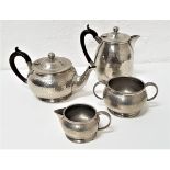 HAMMERED PEWTER TEA SET comprising a tea pot, hot water jug, twin handled sugar bowl and milk jug (
