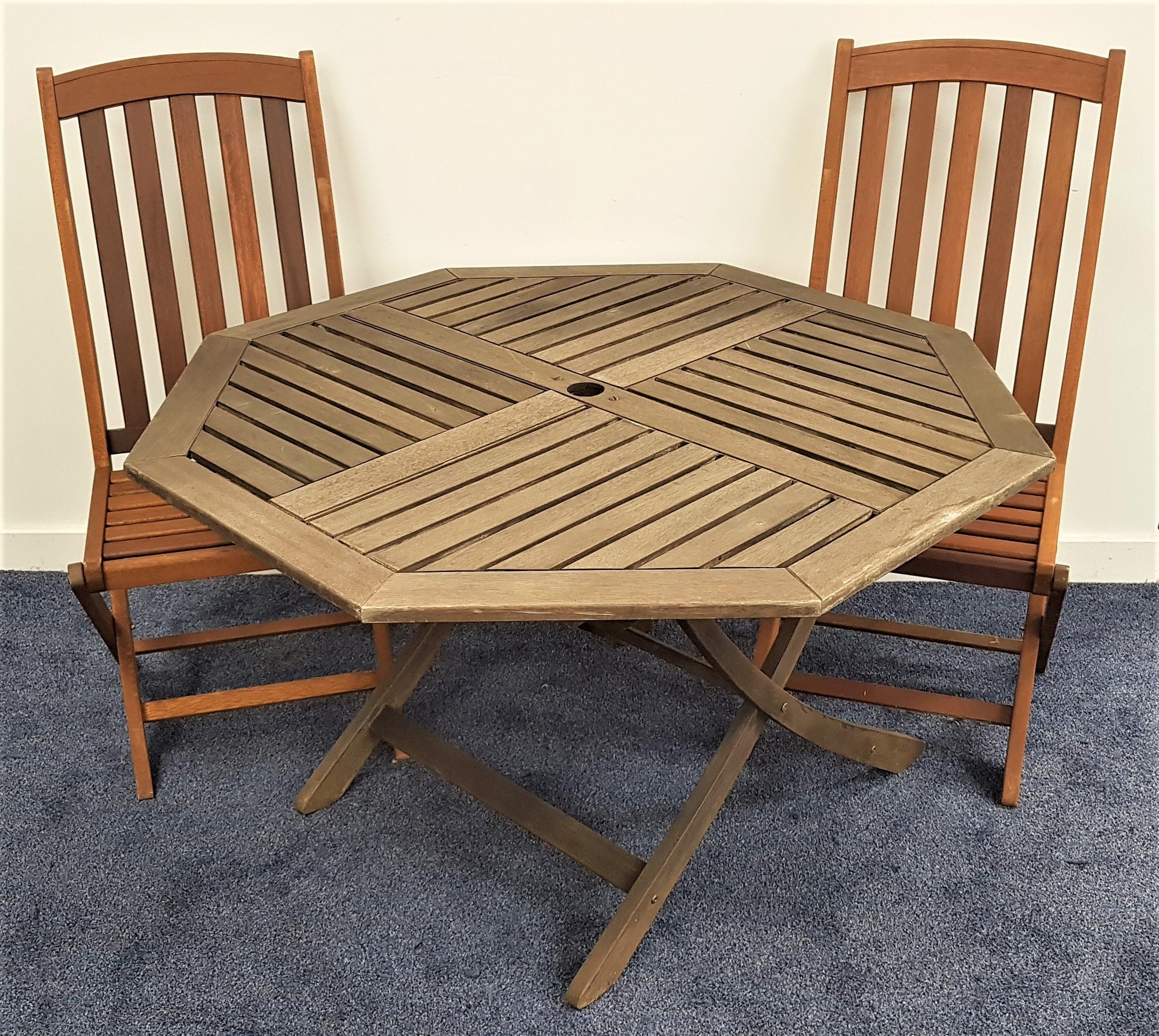 TEAK OCTAGONAL GARDEN TABLE with a slatted top on folding supports, 110cm wide, together with two