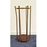 CIRCULAR OPEN STICK STAND the six brass columns with circular finials, and a circular mahogany base,