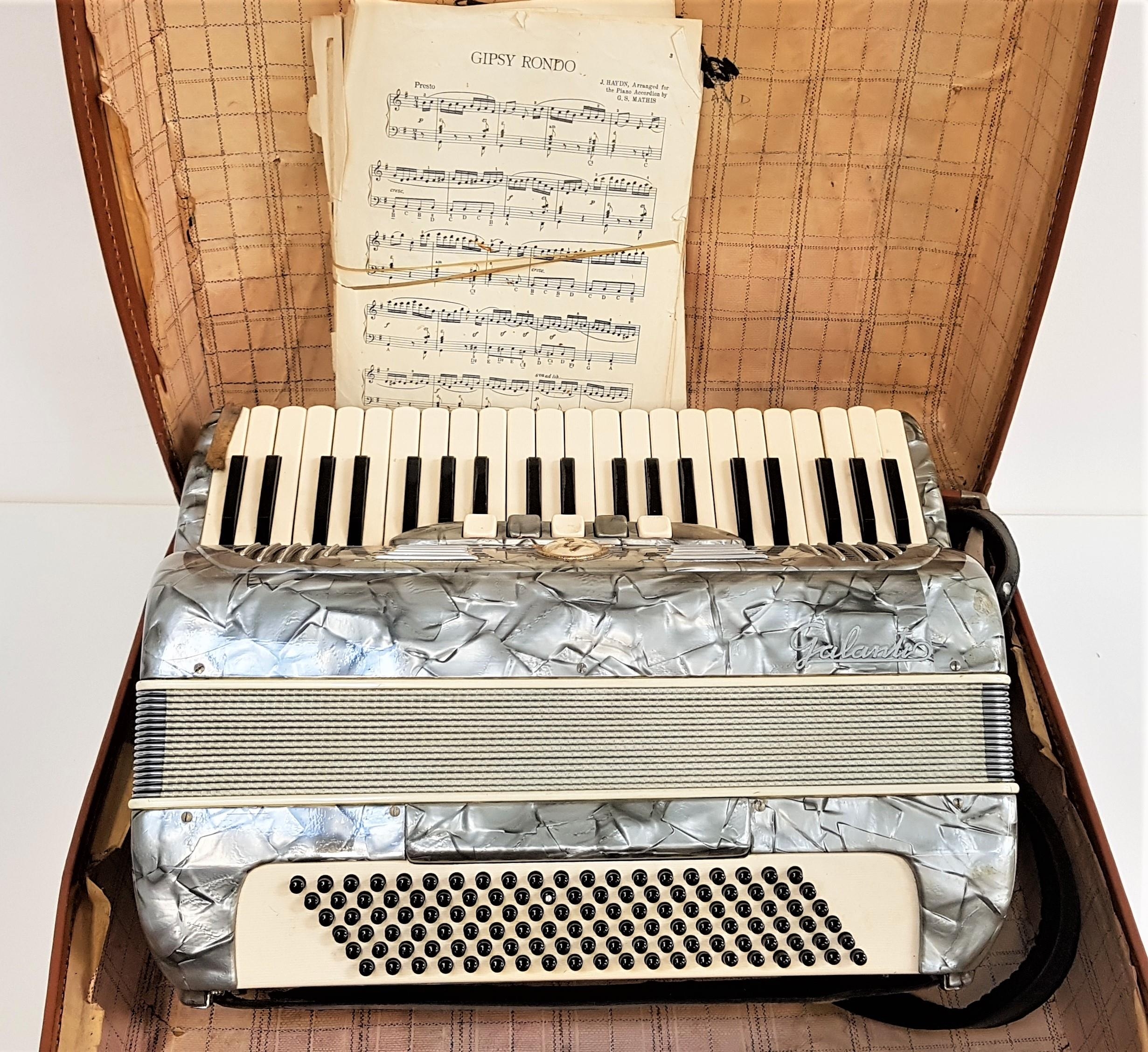 GALANTIO ACCORDIAN with a mottled grey body with shoulder straps and travel case, with a selection