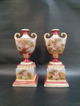 PAIR OF ROYAL VIENNA URN SHAPED VASES decorated with panels of classical figures with gilt