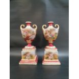 PAIR OF ROYAL VIENNA URN SHAPED VASES decorated with panels of classical figures with gilt