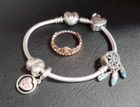 SELECTION OF PANDORA JEWELLERY comprising a heart clasp Moments silver charm bracelet with four