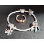 SELECTION OF PANDORA JEWELLERY comprising a heart clasp Moments silver charm bracelet with four