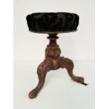 VICTORIAN MAHOGANY PIANO STOOL with a circular padded height adjustable seat, on a carved column and